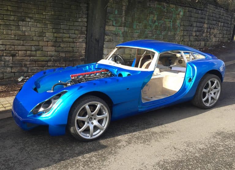 Restored blue TVR sports car with door open